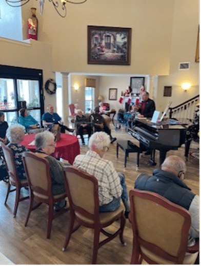 What is the best way to get the Christmas spirit flowing you ask? Well for us at Knollwood, the answer to that is Pastor Gray paying us a visit to read a “Christmas Story” followed by some hymns and carols in the lobby!