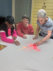 Knollwood residents enjoy fun and connection with the Magic Table.